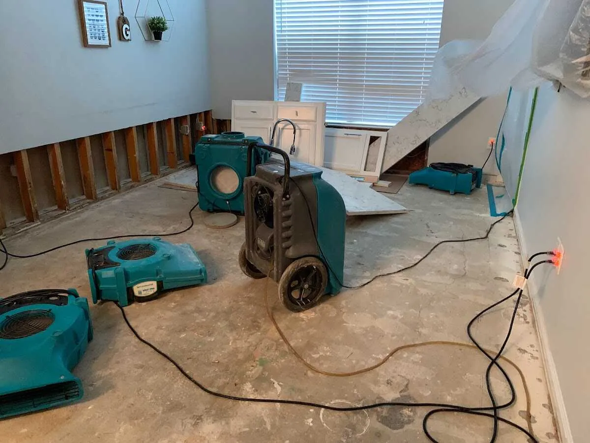 Dehumidifier in flood-cut room for Water Damage Restoration in Ash
